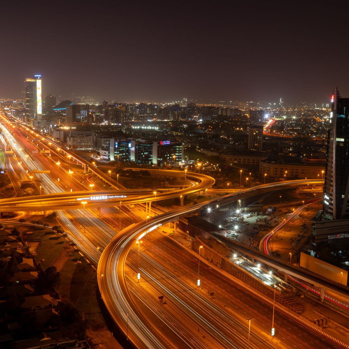 Dubai night cityscape with illuminated roads